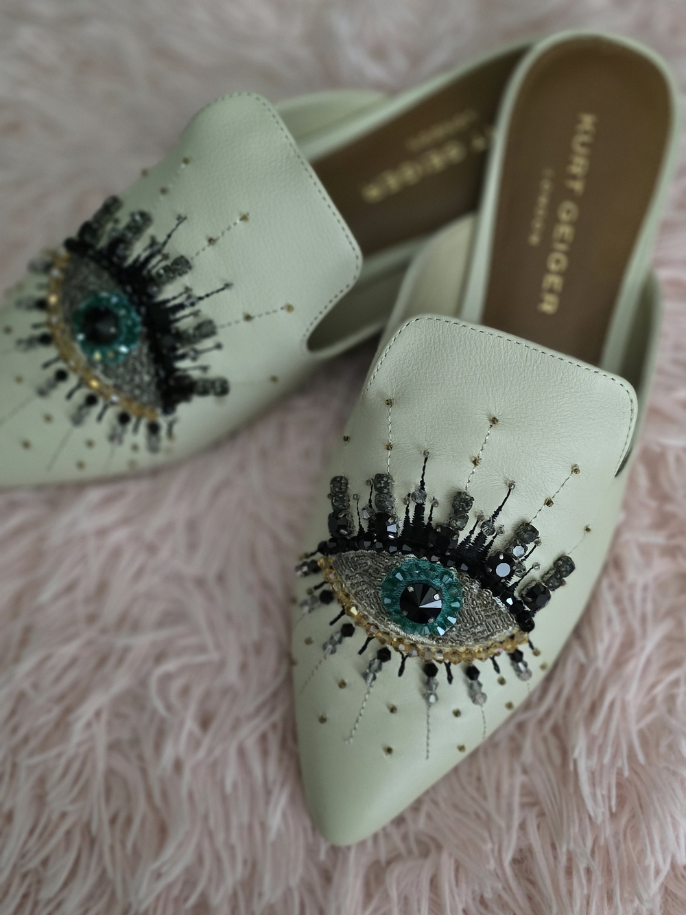 Kurt Geiger White Pointed Eye-Embellished Leather Mules with Teal Gem